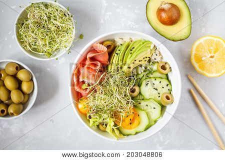 Hawaiian fish poke with rice avocado and sprouts.