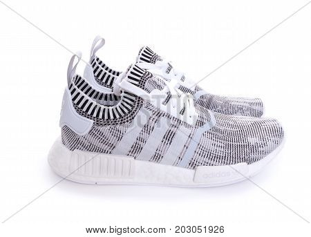 Kuala Lumpur, Malaysia - July 23, 2017: Rear view of Adidas NMD R1 Primeknit Oreo White Black Glitch Camo BY1911 sneaker on white background