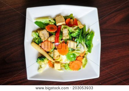 Stir-Fried Mixed Vegetables, Stir-fried broccoli, baby corn, carrots, peapods, napa and bell pepper in a soy sauce