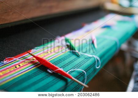 wooden weaving shuttle for homemade silk weaving traditional thai fabric Chiang Mai Thailand
