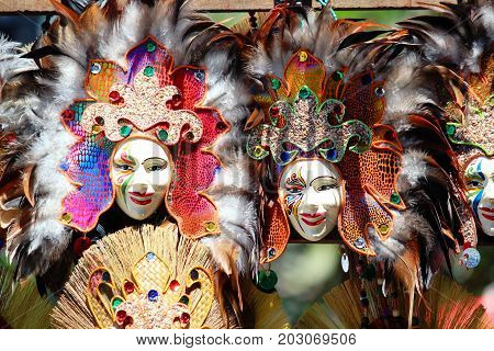 Masks of different attractive colors and feathers on display at the Kadayawan Festival in the streets of Davao City, Philippines in August each year.