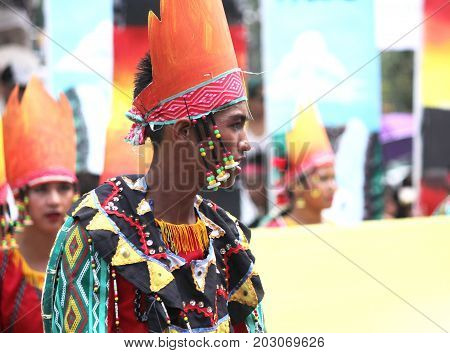 DAVAO CITY, PHILIPPINES--AUGUST 2014: A boy with colorful headdress and ethnic costume at the parade.
Kadayawan is celebrated August each year to give thanks for life and an abundant harvest.