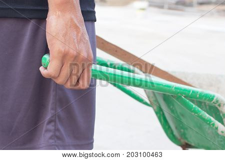 People Hand With The Soil Tralley , Cart Mortar ,wheel Barrow