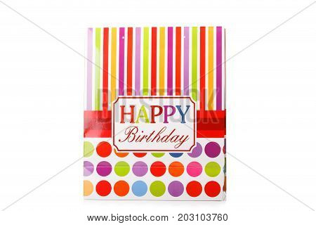 A package with bright red, yellow and pink stripes, a signature happy birthday, packages for presents isolated on a white background.