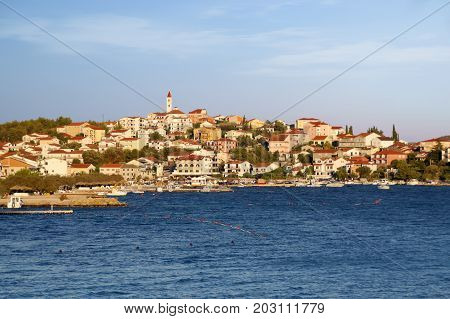Skyline of old town over sea. Seascape of Seget Vranjica near Trogir Croatia.