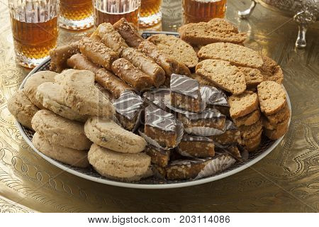 Traditional variety of festive Moroccan cookies and mint tea