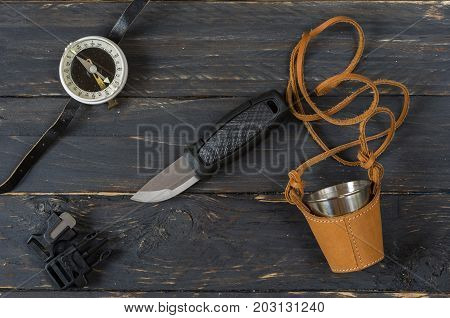 Tourist Accessories On A Black Wooden Background.