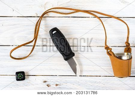 Knife, Compass And Glass On A White Background.