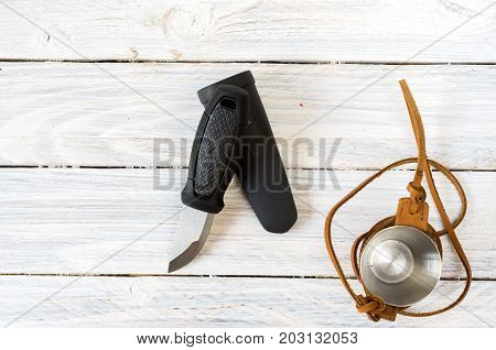 Knife With A Fixed Blade. A Glass In A Leather Case.