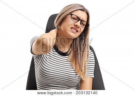 Young woman seated on a seat experiencing neck pain isolated on white background
