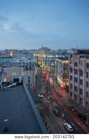 Pyatnitskaya street with road, bike paths and sidewalks at evening in Moscow