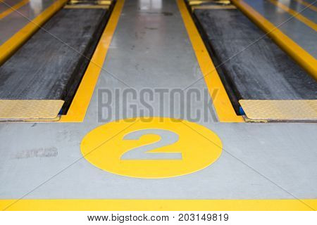 Hydraulic For Car Lift Up In Auto Repair Service Shop. Scissor Jack In Garage. Automobile Maintenace