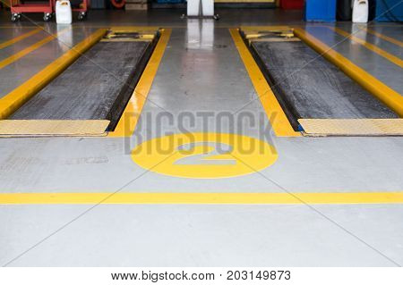 Hydraulic For Car Lift Up In Auto Repair Service Shop. Scissor Jack In Garage. Automobile Maintenace