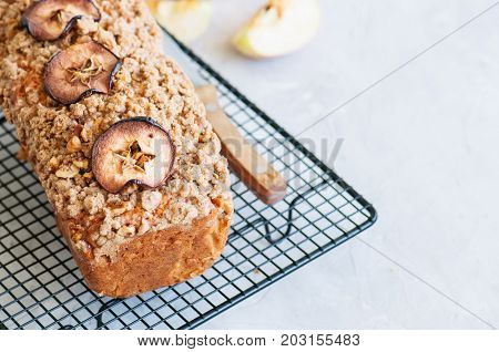 Holland Apple Crumble Bread Served On A Wire Rack On A White Stone Background. Close Up And Copy Spa