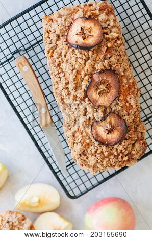 Holland Apple Crumble Bread Served On A Wire Rack On A White Stone Background. Close Up And Copy Spa