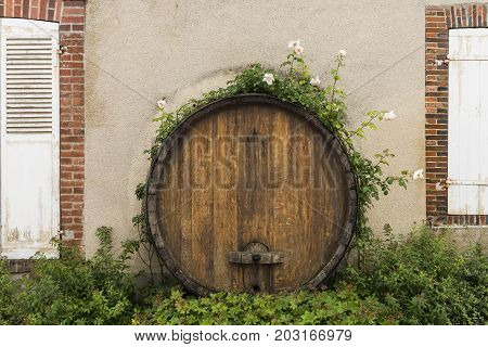 Part of Champagne Barrel with two window shutters in the small town of Hautvillers in the Champagne district in France.