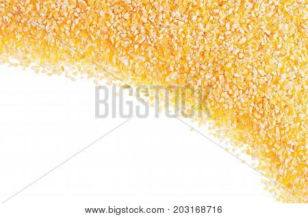 Corn grits as decorative frame isolated on white background. Top view closeup.