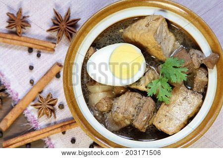 Belly Pork Chinese Five-Spice Stew with boiled egg and tofu braised in brown sauce, asia food.