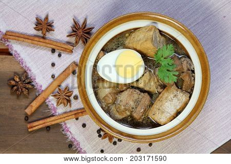 Belly Pork Five-Spice Stew with Half cooked egg and fried soybean curd in brown sauce, food