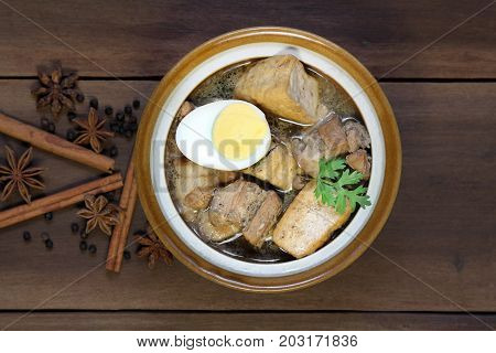 Belly Pork Chinese Five-Spice Stew with boiled egg and tofu in brown sauce.