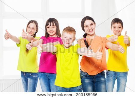 Happy group children in school. Smiling teen. Friedship boys and girls