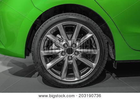 Close Up Rear Wheel Right Of A Green Sports Car, Rear Wheel Drive
