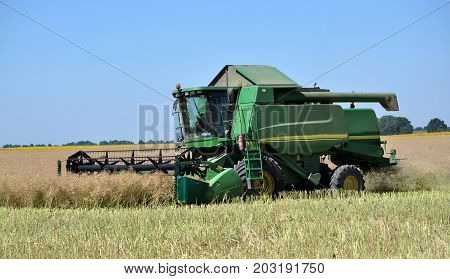 Yahilnytsia - Chortkiv - Ukraine - July 13 2016. Collection of winter rape using the powerful combine harvester in the agricultural sector "Yahilnytske"