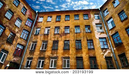 Old House with many Windows and Blue Sky
