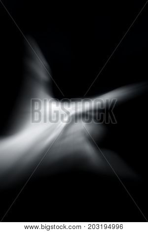 Human hand in symbolic gesture Shot with motion blur effect.