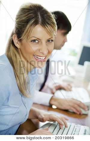 young happy  students learning computer skills