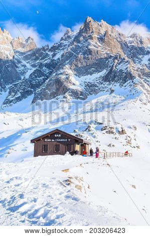 Chamonix, France - January 28, 2015: Bar at middle station of Cable Car Telepherique Aiguille du Midi and mountains panorama Chamonix, France.