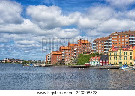 KARLSKRONA SWEDEN - 2017 July. Typical red Swedish wooden houses with natiaonal flag in the city of Karlskrona.