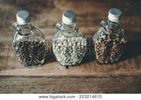 Top View of Green beans and Coffee beans inside the clear bottle Focus only subject blur backgroundCopy Space for Text Layout Chiangmai Thailand