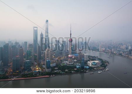 Shanghai pudong lujiazui skyscrapers at morning in fog, top view