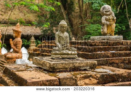 CHIANG MAI THAILAND - 5/14/2015: Buddhist statues and figurines at Wat Pha Lat.