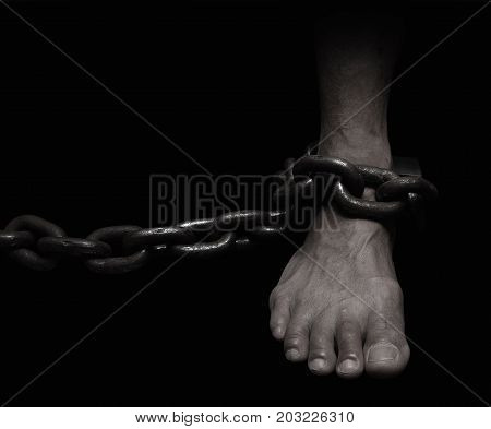 Victim Slave Prisoner male foor tied by big metal chain. People have no freedom concept image.