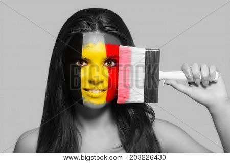 Female supporter in national colors of Belgium
