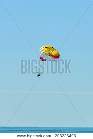 Colored Parasail Wing Pulled By A Boat In The Sea Water, Parasailing Also Known As Parascending Or P