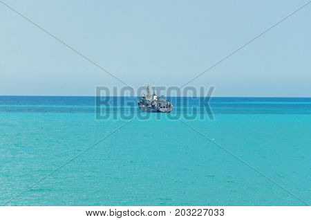 Boat Or Ship Navigating On Blue Black Sea Water, Cargoboat