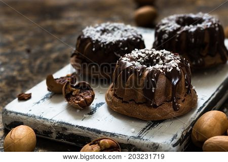 Chocolate Muffins With Pecans Under Chocolate Ganache