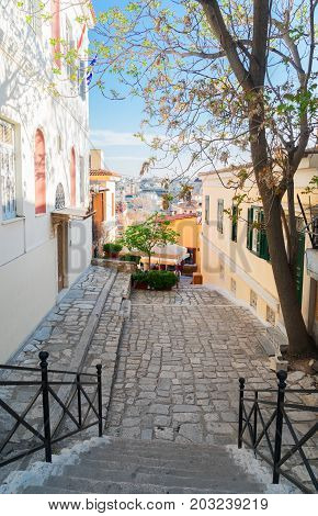 small cosy street with steep stairs of famous Placa district in Athens, Greece