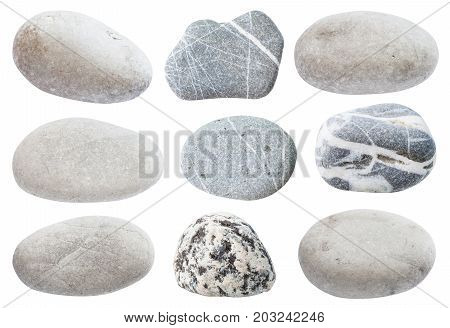 set of various gray natural pebble stones from sea beach isolated on white background