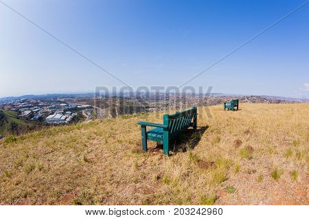Chairs overlooking birds-eye of Pinetown westmead Industrial park alonside Marianhil N2 toll highway