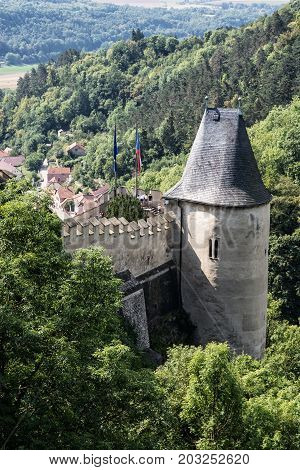Karlstejn is a large gothic castle founded 1348 by Charles IV in Czech republic. Ancient architecture. Vertical composition.