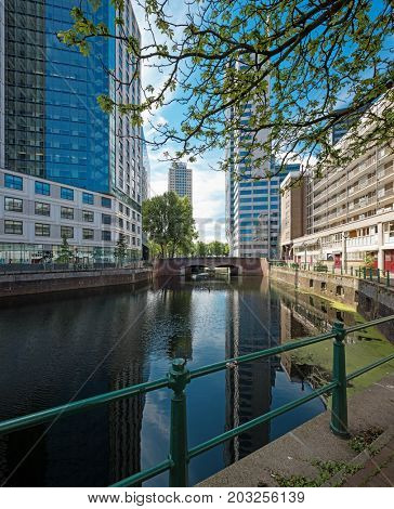 Rotterdam cityscape with canal and skyscraper