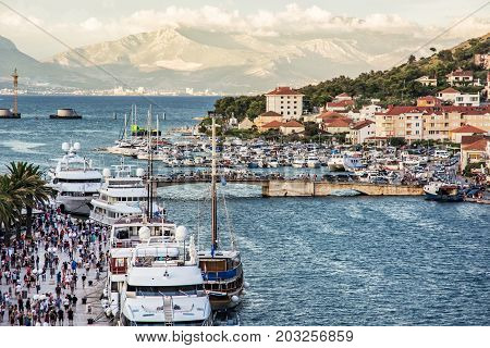 TROGIR CROATIA - JULY 25 2017: The bridge connecting the old town of Trogir and Ciovo island Croatia. Harbor and promenade. Summer vacation destination.