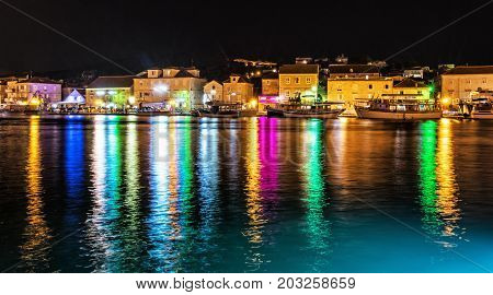 View of houses on the island of Ciovo night colorful scene. Travel destination. Summer vacation.
