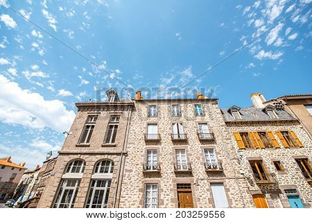 Old buildings in the central square of saint Flour town in Cantal region in France