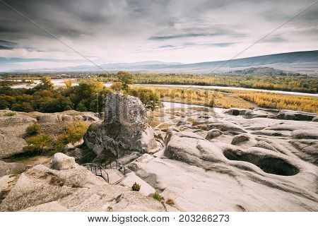 Uplistsikhe, Shida Kartli Region, Georgia. Remnants Of Altar In Famous Landmark Uplistsikhe Is An Ancient Rock-hewn Town In Eastern Georgia. Landscape In Sunny Autumn Day. UNESCO  World Heritage Site.