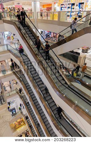 LONDON ENGLAND - JUNE 09 2017: Stairwell with shopping people in famous Selfridges department store London